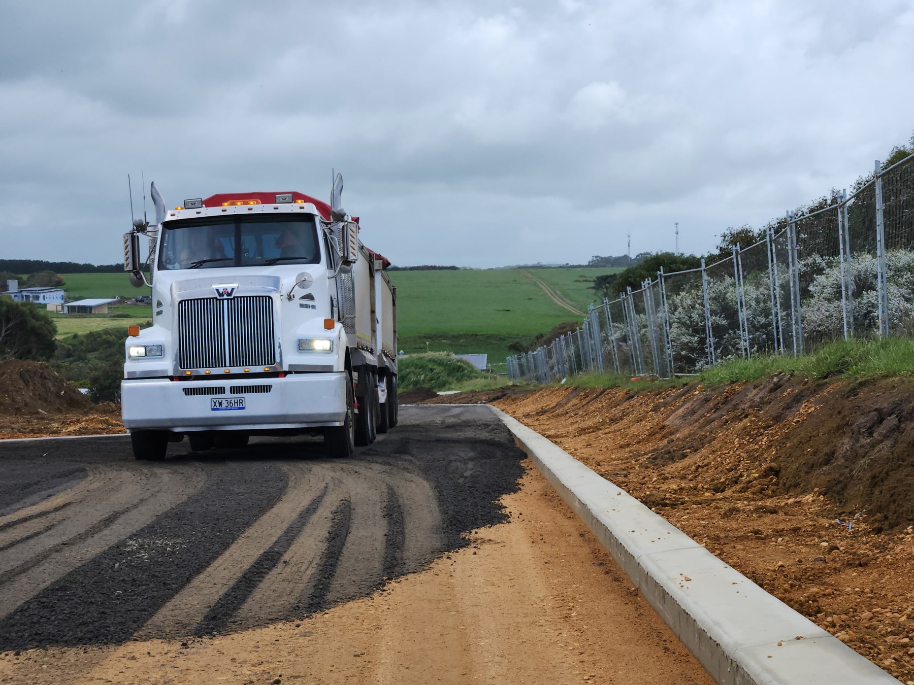 Civil Haulage truck operating on sealed road project